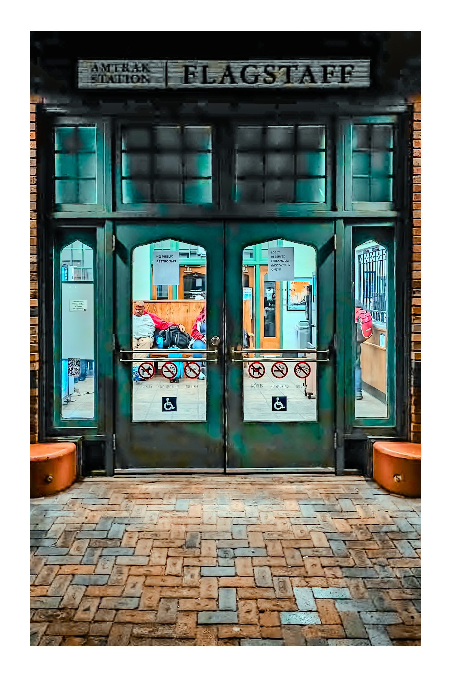 Flagstaff Amtrak Station entrance &mdash; patinated teal doors, historic depot